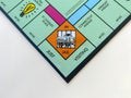 The race car on the In Jail square for the game Monopoly by Hasbro on a white background