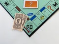 The race car  on the Passing Go square for the game Monopoly by Hasbro on a white background Royalty Free Stock Photo