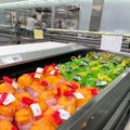 A display of frozen turkeys in the refrigerated meat aisle of a Sams Club grocery store