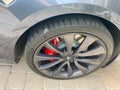 A Tesla with a Michelin tire that has a nail in the tread