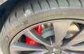 A Tesla with a Michelin tire that has a nail in the tread