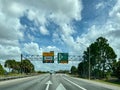 A toll road sign that designates where people should drive to pay tolls for EPass and Sunpass in Orlando, Florida