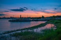 Beautiful panoramic view of Grand Floridian Resort & Spa, green forest and Magic Kingdom wharf on colorful sunset background at Wa