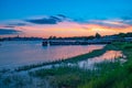 Beautiful panoramic view of Grand Floridian Resort & Spa, green forest and Magic Kingdom wharf on colorful sunset background at Wa