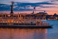 Disney Ferry boat and partial view of Grand Floridian Resort & Spa on sunset background at Walt Disney World  area 2 Royalty Free Stock Photo