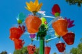 Parents and kids enjoying colorful flower pots aboard AbbyÃ¢â¬â¢s Flower Tower on lightblue sky background at Seaworld in Internatio