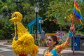 Big Bird and woman dancer with colorful flag at Seaworld