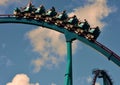 Riding roller coaster at amusement park.