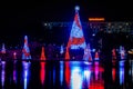 Illuminated and colorful Sea of Christmas Trees and partial view of Reinassance Hotel at Seaworld 11.