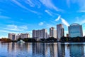 Panoramic view of downtown buildings , vintage fountain and swan boat on lightblue cloudy background in Lake Eola Park area.