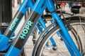 ORLANDO, FLORIDA - JULY 13, 2019: Blue HOPR bike share bicycles parked on a downtown street Royalty Free Stock Photo