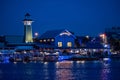 Panoramic view of colorful dockside on blue night in Disney Springs at Lake Buena Vista