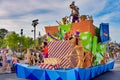 Goofy and Pluto in Mickey and Minnie`s Surprise Celebration parade at Walt Disney World .