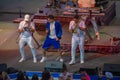 Randy Malcom by Gente de Zona dancing with two trumpeters from the band at Seaworld in International Drive Area 3