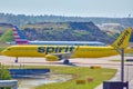 Spirit Airlines and American Airlines aircraft on runway preparing for departure from the Orlando International Airport MCO.