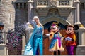 Elsa, Minnie and Mickey on  Mickey`s Royal Friendship Faire on Cinderella Castle in Magic Kingdom at Walt Disney World Resort  3 Royalty Free Stock Photo