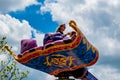 People enjoying The Magic Carpets of Aladdin sign in Magic Kingdom at Walt Disney World  4 Royalty Free Stock Photo