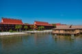 Polynesian Resort cabins and Disney`s Grand Floridian Resort & Spa on sunset background at Walt Disney World  1 Royalty Free Stock Photo