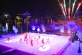 Artist group skating at Christmas Show on ice on colorful background with fireworks in International Drive area. Royalty Free Stock Photo