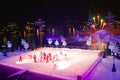 Artist group skating at Christmas Show on ice on colorful background with fireworks in International Drive area. Royalty Free Stock Photo