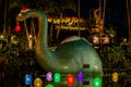 Big dinosaur and Christmas decorations in Echo Lake at Hollywood Studios 530.