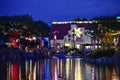 Christmas market and colored lights reflected in the lake at night in International Drive area. Royalty Free Stock Photo