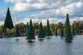 Christmas trees on lake on lightblue cloudy sky background at Seaworld 2.