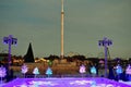 Ice skating scene , colorful holidays trees and Christmas Tree on lake and Sky Tower background in International Drive area