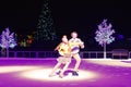 Nice couple skating on ice at Christmas Show in International Drive area.