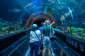 People enjoying Shark encounter tunnel at Seaworld 2