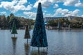 Christmas tree on blue lake and Shamu Stadium at Seaworld 1