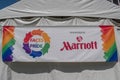 Faces of Pride by Marriott sign in Come Out With Pride Orlando parade at Lake Eola Park area 174.