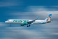 Frontier Airlines aircraft preparing to landin airport area 2