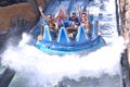 Funny people raising hands, having fun Infinity Falls at Seaworld Theme Park.