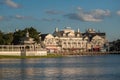 Partial view of lovely victorian ride on dockside and charming colorful buildings at Lake Buena Vista.