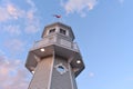 Top view of lighthouse on lightblue sky and magenta clouds background, at Lake Buena Vista are Royalty Free Stock Photo