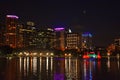 City skyline and colorful water fountain at night in Lake Eola Park . Royalty Free Stock Photo