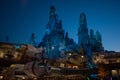 Partial view of Millennium Falcon spaceship and rocky mountain in Star Wars Galaxy Edge at Hollywood Studios