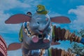 People enjoying Dumbo the Flying Elephant at Magic Kigndom 7.