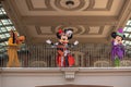 Pluto, Mickey and Minnie Mouse waving from the balcony at Walt Disney World Railroad in Halloween season at Magic Kingdom. Royalty Free Stock Photo