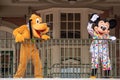 Pluto and Mickey Mouse waving from the balcony at Walt Disney World Railroad at Magic Kingdom 343 Royalty Free Stock Photo