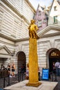 Orlando, USA - Feb. 12, 2021: Golden statue of gringotts goblin on coins