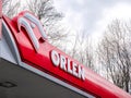 Orlen Polish gas station comapny, brand signage outdoors, logo sign closeup detail, nobody Oil refiner, petrol retailer