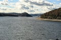 Orlik dam with hills on horizon and loosed level