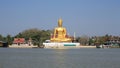 Ornament: huge gold buddha statue near river Royalty Free Stock Photo
