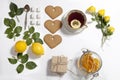 Ornament of lemons, cookies and rose leaves on white background. Recipe of gingerbread Royalty Free Stock Photo