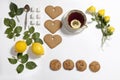 Ornament of lemons, cookies and rose leaves on white background. Recipe of gingerbread Royalty Free Stock Photo