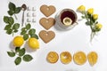 Ornament of lemons, cookies and rose leaves on white background. Recipe of gingerbread Royalty Free Stock Photo