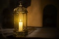 Ornamental Arabic lantern with burning candle glowing