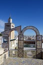 Ornamental arches on roof top terrace and mosque tower in Tunisia Royalty Free Stock Photo